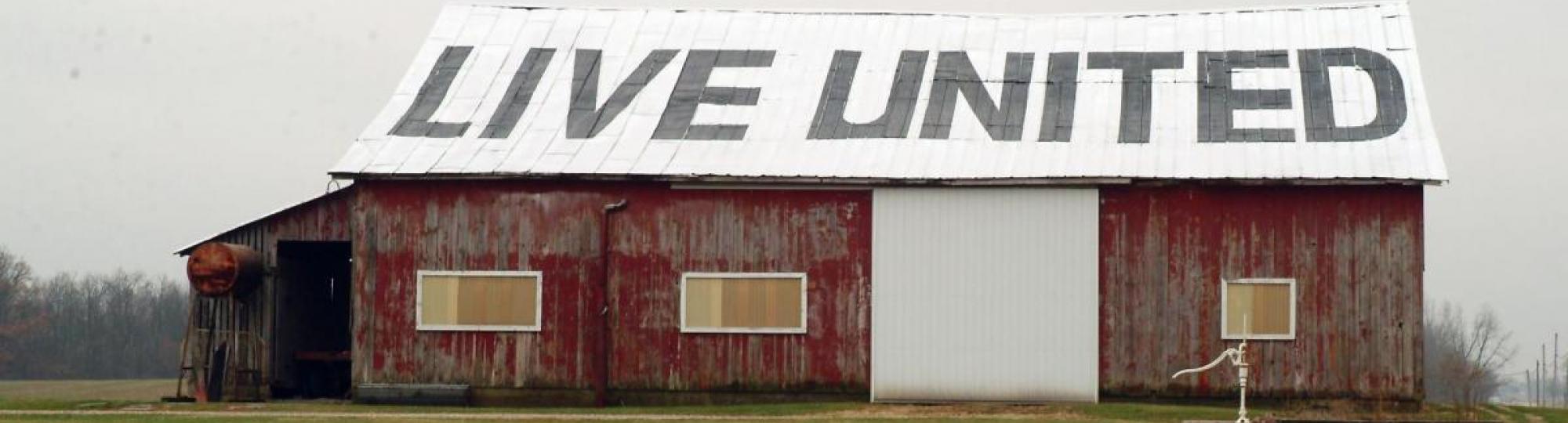 barn with live united slogan painted on roof